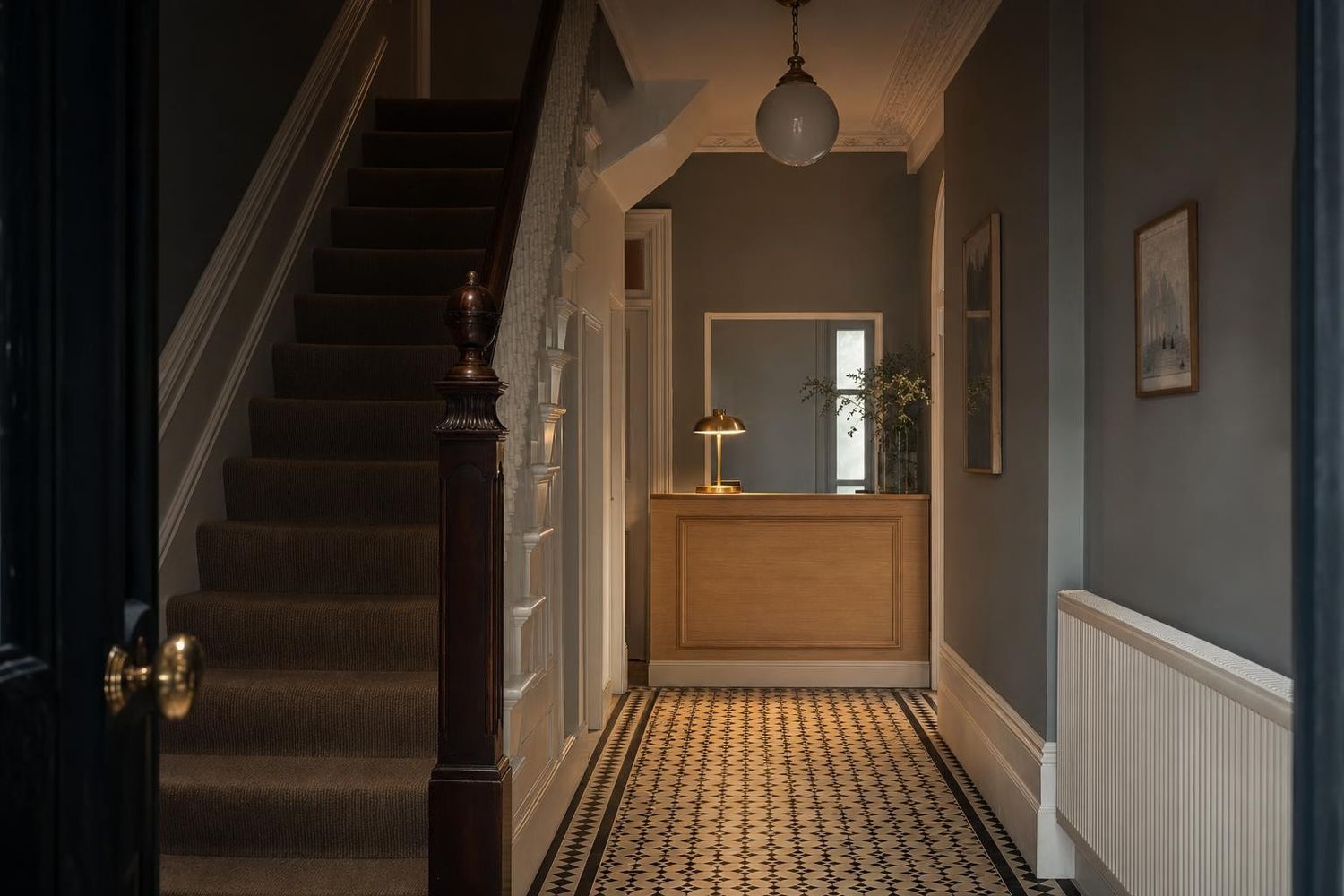 The tiled hallway and reception desk at Tidewell House